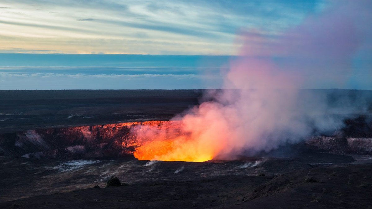 Night view of an active Volcano with smoke in Hawaii